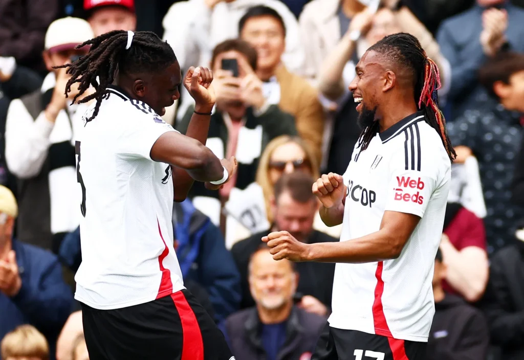 Iwobi celebrating Premier League appearance record with Fulham jersey