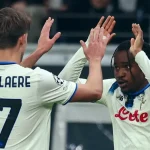 Lookman celebrating with teammate